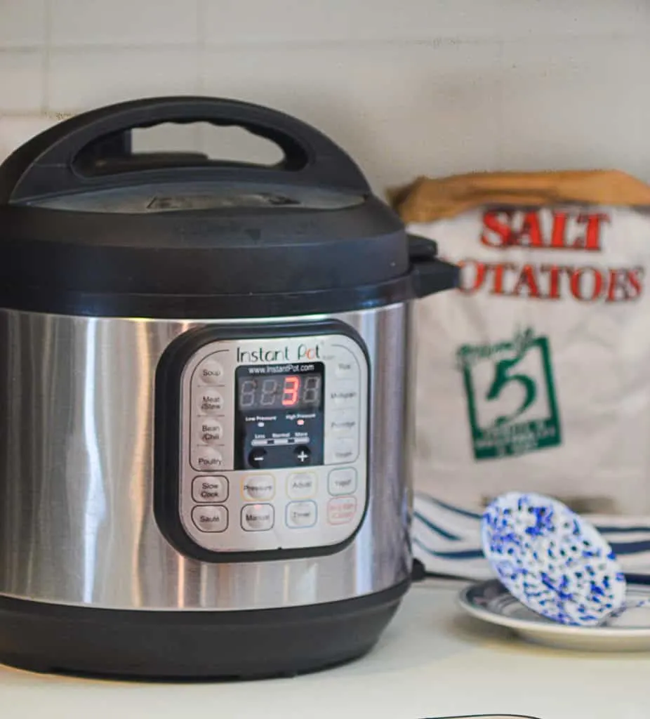 An Instant Pot ona kitchen counter top, set for 3 minutes high pressure to cook Syracuse Salt Potatoes