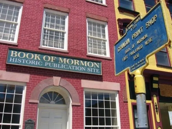 View of the fron of the Book of Mormon Historic Publication site with the Grandin Print Shop historical marker in the foreground. 